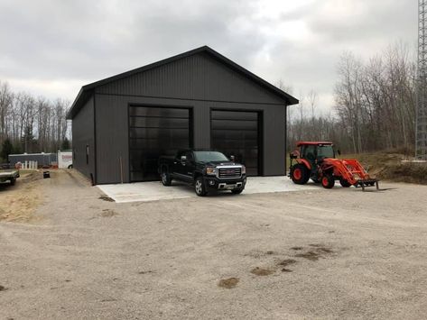 Pole Building Garage Ideas, Backyard Workshop Buildings, Black Metal Garage Buildings, Black Metal Shop Building, Black Metal Garage, Metal Garage Ideas, Shop Must Haves, Black Metal Shop, Black Pole Barns