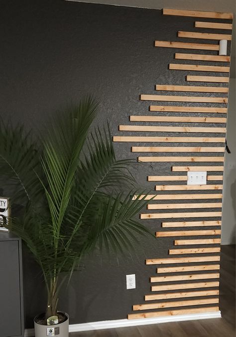 Wood Texture On Wall, Wood Accent Wall Spa, Salon Wood Wall, Airbnb Accent Wall, Podcast Wall, Wooden Slat Wall Interiors, 1x2 Accent Wall, Black Wall With Natural Wood Slats, Geometric Wood Slat Accent Wall