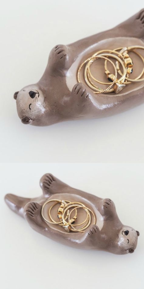 A hand painted otter jewelry holder by Paint My Dream. Otter Ring Holder, Otter Clay Dish, Cute Ring Holders Clay, Pottery Painting Jewelry Holder, Air Clay Ring Holder, Ring Clay Holder, Clay For Jewelry Holder, Ceramic Art Jewelry Holder, Air Dry Clay Ring Holder Diy