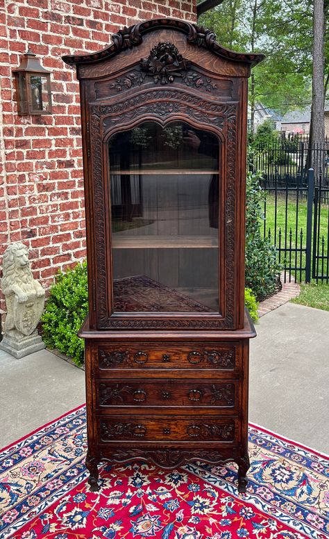 BEAUTIFUL Antique French Country Carved Oak Bonnet Top Bookcase, Bonnetiere or Vitrine Over 3 Drawer Chest ~~HIGHLY CARVED~~c. 1870s Versatile size~~SLIM profile fits in smaller spaces~~84" tall x 31.5" wide x 14" deep~~removable "bonnet" top PERFECT for displaying your favorite antique books and collectibles~~lower chest for extra storage Exquisite crossed torch, lovebird, rose and ribbon carvings~~old pegged construction~~original "wavy" glass and original key included Three (3) drawers in low Old Antique House Decor, Small Victorian Dining Room, 1800s Furniture, Waterfall Bookcase, Victorian Furniture Antique, Antique Wooden Furniture, Victorian Furniture Decor, Old Wooden Furniture, Antique Display Cabinet