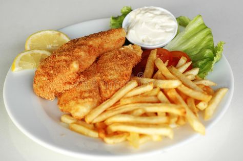 Fish and chips in a plate. Fish and chips served on a table with lemon and cream #Sponsored , #Affiliate, #SPONSORED, #chips, #lemon, #cream, #plate Chips Design, Fish And Chips, Video Footage, A Table, Royalty Free Stock Photos, Royalty, Royalty Free, Stock Images, Chips