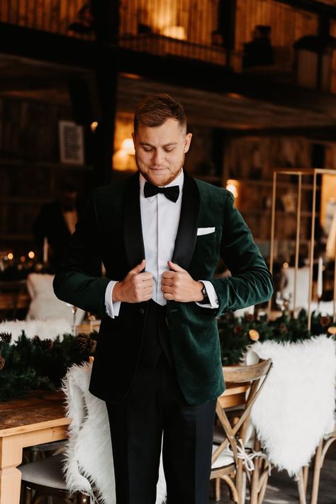 Groom in black tie outfit with velvet green suit jacket for winter wedding in barn venue based in the Lake District Groom Outfit Winter Wedding, Wedding Suits Groom Emerald Green, Velvet Suit Jacket Wedding, Groom Suit Black Tie, Green Suit Jacket Wedding, Men’s Wedding Suits 2023, Emerald Green Tie Black Suit, Forest Green Velvet Suit Men, Green Jacket Groom