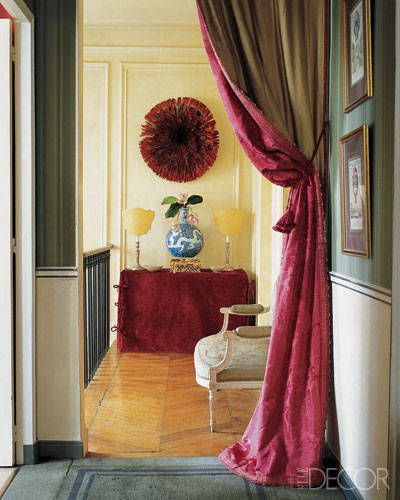 Rose Anne De Pampelonne Beaux Arts Interiors - On a staircase landing, a Bamileke feather headdress from Cameroon hangs above a console slipcovered in velvet; the silk-damask curtain is antique. Damask Curtains, Doorway Curtain, Curtain Room, Chinoiserie Chic, Custom Drapes, Closet Door, Velvet Curtains, Hanging Curtains, Interior Design Tips