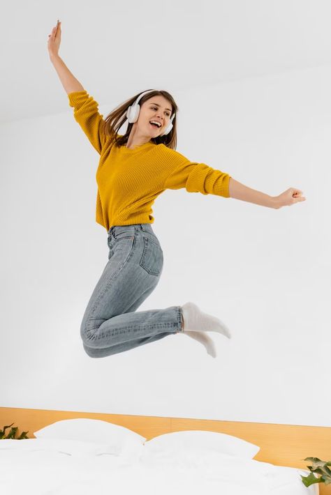 Woman With Headphones, Woman Jumping, Jumping Poses, Wearing Headphone, Student Photo, Listening Music, Advertisement Design, Pose Inspiration, Inspirational Photos