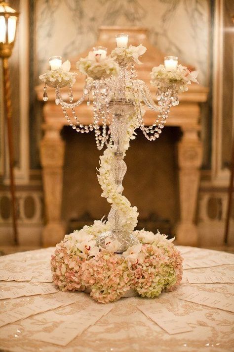 Such a lovely floral centerpiece with towering candles and hanging crystals #wedding #gatsby #centerpiece #flowers #artdeco Affordable Wedding Centerpieces, 1920s Wedding, Gatsby Wedding, Victorian Wedding, Miami Wedding, Deco Floral, Affordable Wedding, Floral Theme, Color Inspo