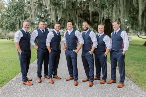 Groom and groomsmen pose for pictures before charming southern wedding. Love their cognac shoes and blue pants and vests! Check out the rest of the wedding at thebridalfinery.com. Blue and tan menswear // mens wedding fashion // groomsmen ideas // groomsmen outfits Groomsmen Just Vests, Gray Vest And Pants Groomsmen, Groomsmen Just Shirt And Tie, Vest Only Groomsmen, Open Collar Groomsmen, No Jacket Wedding Groom Attire, Groomsmen Vest And Bowtie, Navy Vest Outfit Mens, Navy Blue Vest Groomsmen