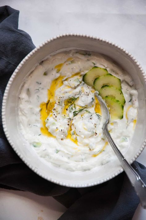 For a light, tangy, and refreshing dip that's full of flavor and protein, try this Healthy Tzatziki Sauce Recipe. It's a wonderful seven-ingredient dish that's ready in less than 15 minutes. Healthy Tzatziki Sauce, Healthy Tzatziki, Low Calorie Sauces, Erin Lives Whole, Best Dip Recipes, Tzatziki Sauce Recipe, Homemade Tzatziki Sauce, Tzatziki Recipes, Homemade Tzatziki