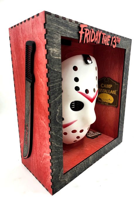 Adult Size Jason Voorhees Hockey mask SHADOW BOX.  WITH Multi Color LEDS AND REMOTE. Takes 3 AA Batteries that are NOT INCLUDED Features Camp Crystal Lake plaques on the inside. And large Machetes down each side on the outside that say Friday the 13th.  Box is hand stained BLACK AND RED Upgrade to weathered Mask available for only 10 dollars.  Size large 12 INCHES TALL 11 INCHES WIDE AND 5 INCHES DEEP Horror Living Room, Horror Bedroom, Bratz Birthday, Jason Voorhees Hockey Mask, Jason Friday The 13th, Horror Toys, Horror Collectibles, Scary Gift, Black Room Decor