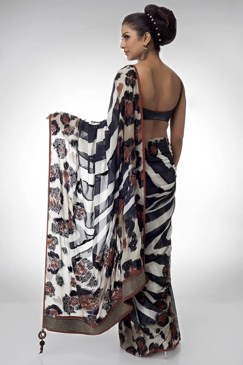 zebra stripe saree with stone and threadwork (back view) Designer Fancy Sarees, Classy Sarees, Exclusive Saree Blouse Designs, Modern Sarees, Sri Lankan Wedding, Satya Paul, Travel Influencer, Modern Saree, Eternal Beauty