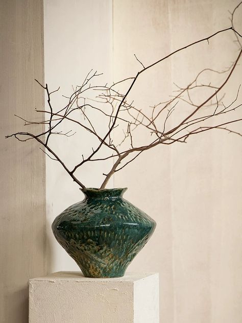 Introduce a touch of rustic charm to your home with our wabi-sabi irregular ceramic vases. Each rustic vase is handmade, featuring a with a dark green glossy glaze. The irregular design and texture of these ceramic pieces bring a distinctive and natural feel to any space, perfect for showcasing your love of organic elements. Versatile and unique, our textured ceramic vases are ideal for indoor plants, soil plants, fresh flowers, or even artificial flowers. Their rustic design easily coordinates Green Ceramic Vase, Japandi Penthouse, Wabi Sabi Color Palette, Modern Vases Decor, Textured Vases, Japandi Lamp, Organic Vase, Plant Vases, Rustic Vases