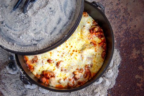 Outdoor cooking doesn't have to mean eating instant potatoes or rice and beans. This Dutch oven lasagna recipe ensures a delicious backcountry dinner. Cast Iron Lasagna Recipe, Lasagna In Dutch Oven, Camping Lasagna, Soup In Dutch Oven, Dutch Oven Lasagna Recipe, Dutch Oven Breakfast, Dutch Oven Lasagna, Dutch Oven Camping Recipes, Dutch Oven Chicken