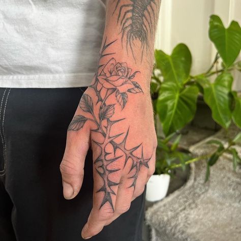 Thorned rose hand tattoo Rose Thorn Tattoo, Thorn Tattoo, Rose Hand Tattoo, Rose Thorns, Hand Tats, Tattoo Instagram, Arm Tattoos, Hand Tattoo, Arm Tattoos For Guys