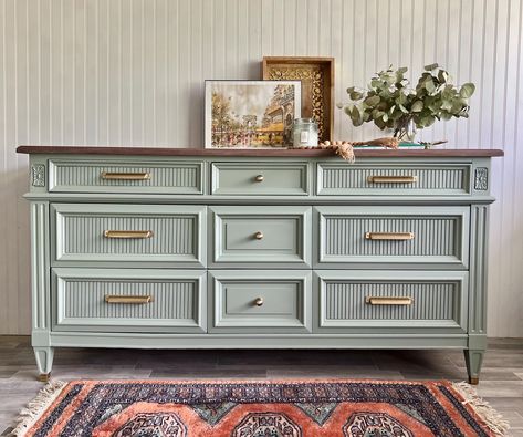 *Shipping is NOT FREE. Please message us with your zip code to get started.* *Item is NOT available to purchase/ has sold* MCM dresser/ sideboard refinished in a mid-tone finish with gray and warm green tones, fluted drawer fronts and vintage brushed brass pulls. Upper drawers are lined with vintage birds and berries floral paper. Dovetailed joint drawers slide smooth on wood tracks. Clean interior. L: 64 " W: 20" H : 32 1/4 " This piece has been preloved and shows signs of use and aging, adding Light Green Dressers Painted, Coastal Modern Furniture, Cool Dresser, Furniture Flipping Ideas, Mint Dresser, Refinished Bedroom Furniture, Refinished Buffet, Dresser Remodel, Mcm Bedroom