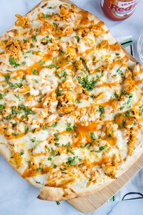 Buffalo chicken pizza is two popular foods put together, with spicy wing sauce, juicy chicken, and creamy ranch on a golden-brown pizza crust. Buffalo Chicken Dio, Homemade Buffalo Chicken Pizza, Buffalo Chicken Rice Crust Pizza, Buffalo Chicken Naan Pizza, Ooni Buffalo Chicken Pizza, Buffalo Pizza, Buffalo Chicken Pizza Recipe, Hand Held Food, Easy Chicken Wings