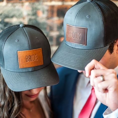 Bride and Groom hats, anyone?! 👰🏻🤵🏼While we may not necessarily *suggest* walking down the aisle in these, we certainly wouldn’t stop you! 😜 And they’re perfect for honeymooners or the bachelor and bachelorette parties leading up to the big day! 🎉🎉🎉⁣ ⁣ #weddinggifts #bacheloretteparty #bachelorparty #rusticweddings #wedding #weddingday #weddinginspiration #weddingideas #weddedbliss #ido ⁣ #truckerhatcustom #truckerhat #truckerhats #customhat #leatherhat #hat #hats #hataddict #leathergift Groom Hats, Western Themed Wedding, Cowboy Wedding, Country Theme Wedding, Personalized Hats, Wedding Activities, Horween Leather, Personalized Bride, Future Wedding Plans