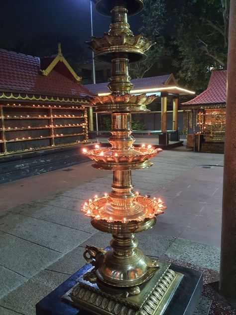 It's a Hindu temple and ladies ate restricted to enter in shorts. Guruvayoor Temple, Guruvayur Temple, Brass Utensils, Pooja Door, Brass Diyas, Pooja Door Design, Pooja Decor, Wedding Backdrop Design, Wedding Backdrop Decorations