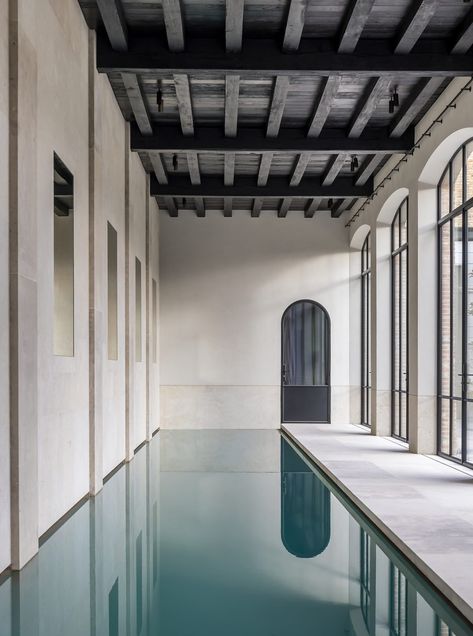 Best of Est | Residential Pools and Pavilions | est living Barn Pool, Interior Minimal, Residential Pool, Bruges Belgium, Built In Furniture, Indoor Swimming, Arched Windows, Historical Architecture, Indoor Pool