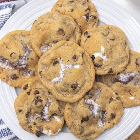 S'mores stuffed cookies are a loaded chocolate chip cookie. Loaded with graham cracker, chocolate and marshmallows in each bite! Give these cookies a try soon! #passion4savings #cookies #smores #stuffed #chocolatechip #marshmallows #grahamcracker S’mores Chocolate Chip Cookies Easy, S'mores Chocolate Chip Cookies, Graham Cracker Chocolate Chip Cookies, S’more Chocolate Chip Cookies, Smores Chocolate Chip Cookies, S’mores Chocolate Chip Cookies, Cookies Smores, Smores Cookies Recipes, Cracker Chocolate