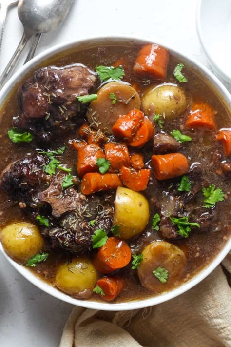 This oxtail stew recipe is warm, hearty, savory and so comforting! It simmers away until the meat becomes fall off the bone tender. This beef oxtail is incredibly flavorful. Great for family dinners, cold winter nights, meal prep and leftovers! Why You’ll Love This Recipe This beef oxtail stew recipe is savory and delicious. It […] The post Oxtail Stew Recipe appeared first on Organically Addison. Oxtail Beef Stew, Oxtail Recipes South African, Stewed Oxtail Recipe, Oxtail Crockpot Recipes, Ox Tail Recipe Southern, Best Oxtail Recipe, Ancestral Recipes, Oxtail Recipes Crockpot, Jamaican Soup