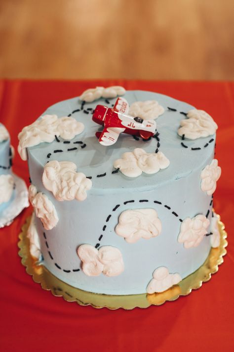 airplane themed birthday cake with clouds light blue #cake #birthday #buttercream #cake decorating Airplane Cake Buttercream, Plane Theme Birthday Cake, Airplane Sheet Cake, Airplane Themed Birthday Cake, Time Flies Smash Cake, Airplane First Birthday Cake, Airplane Cakes For Boys, Birthday Cake Airplane, Airplane Theme Cake