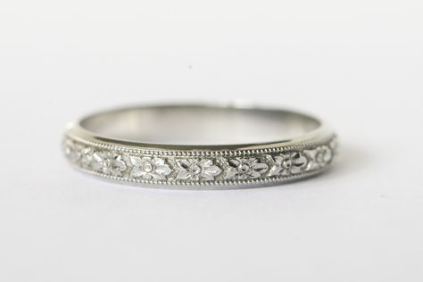 Beautiful 18k white gold engraved wedding band!  This band is wider than the typical engraved band which gives it the space needed for all the details to really show!  The center of the band has intricate flowers with a milgrain border.  There is a small band of plain white gold on either side and it gives the band such an elegant look.  Inside it has the 18k hallmark along with the lion that is Blancard & Co.'s hallmark.  They were a New York jeweler in the early to mid 20th century and made go White Gold Band Ring, White Gold Bands Women, Marriage Ring White Gold, Engagement Ring Engraved Band, Engraved Wedding Bands For Women, Wedding Bands For Women Platinum, Wedding Bands For Women White Gold, Wedding Bands For Women Silver, Vintage Wedding Rings White Gold