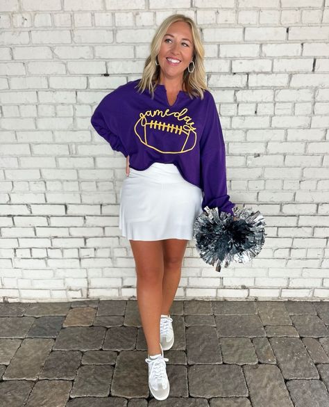 Fan fashion 💜💛⁠ ⁠ Shop our Game Day Collection 🏈 for all your team spirit style!⁠ ⁠ (Model: Purple Game-day Cropped Sweatshirt/ Medium, Moving Crossover Waist Active Skirt/ Large)⁠ ⁠ .⁠ .⁠ www.pinkchairboutique.com ⁠ ⁠ #pcb #pinkchair #pinkchairboutique #boutiquefashion #ootd #senoia #shoplocal #newarrivals #boutiqueshopping #classicstyle #womensfashionstyle #fashiontrends2024 #seasonalstyle #trendingstyles #whattowear #outfitideasforwomen #outfitidea #outfitlooks #trendingfashion #onlinebout... Purple And Gold Football Outfit, Lsu Game Day Outfit Winter, Purple Games, Fan Fashion, Vibrant Purple, Football Outfits, Gameday Outfit, Outfit Look, Boutique Fashion