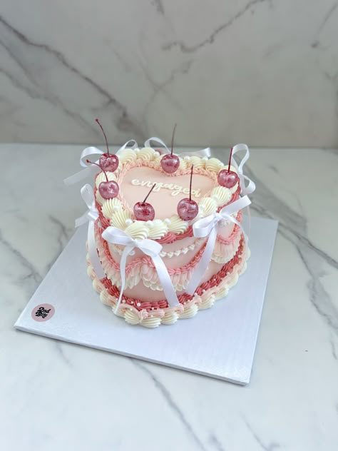 Coquette vintage heart cake with bows and pink glittter cherries Croquette Birthday Cake, Cute Vintage Cakes, Heart Shape Vintage Cake, Cherry Vintage Cake, Coquette Heart Cake, Vintage Cake With Bows, Heart Cake With Bows, Birthday Cake With Bows, Vintage Cake With Cherries