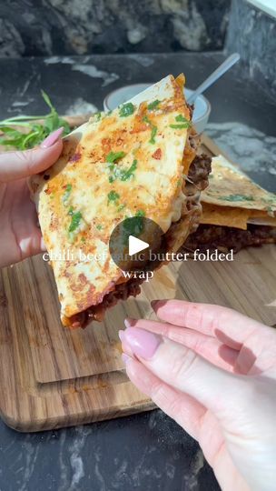 3.1M views · 46K reactions | Chilli beef garlic butter folded wrap 😮‍💨

WOWW the best use of leftovers yet 🙌🏼. Chilli beef folded in a wrap with crispy tortilla chips, melted cheese, a chive sauce and then brushed with garlic butter for an absolute banging quick and easy dinner 🤤

Hit SAVE and let me know if you recreate it 📌💭

Ingredients (serves 2):
2 flour tortilla wraps 
50g grated mozzarella 
2 ladles of leftover chilli (I pasted my chilli recipe 19th June!) https://www.facebook.com/reel/409834932057085?locale=en_GB 
20g tortilla chips - I used chilli heatwave 
5g light butter 
Tsp chopped garlic 
A sprig of parsley chopped 

Chive sauce (could sub with sour cream and chive shop brought) 
60g fat free greek yoghurt
¼ tsp garlic granules 
¼ tsp onion granules 
Tsp dried chive 
T Pizza Wraps Recipes, Leftover Chilli Recipes, Leftover Chilli, Tortilla Wrap Recipes, Chive Sauce, Chilli Recipe, Appetizer Sandwiches, Flour Tortilla, Chilli Recipes