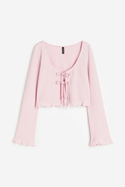 Cropped, fitted cardigan in ribbed jersey. Features a deep, round neckline and an open front with two pairs of narrow ties. Long sleeves and a small frill trim with an overlocked edge at the cuffs and... Pink Crop Cardigan, Cute Pink Cardigan, Bow Cardigan, Rib Cardigan, Dream Aesthetic, Fitted Cardigan, Pink Tie, Ribbed Cardigan, Pink Cardigan