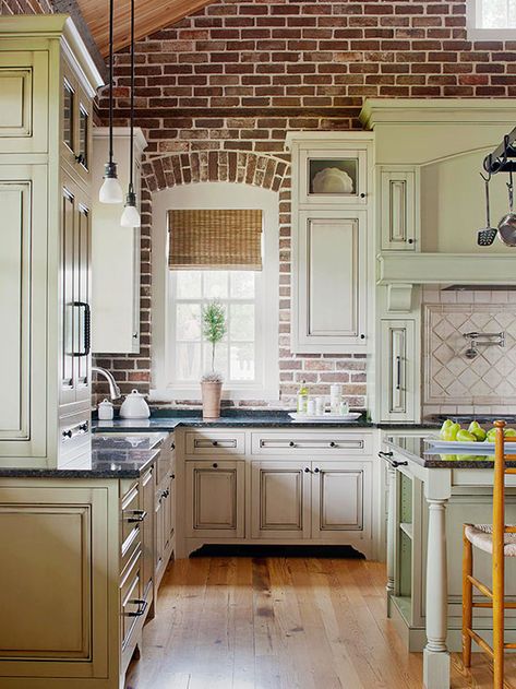 Timeworn Texture - This new kitchen features a brick wall with an old-world look and feel. The rustic look of natural brick adds texture to any room. White cabinets add contrast while blending beautifully with the light-color grout. Kitchen With Brick, Brick Inspiration, Porch Enclosure, Victorian Kitchens, Light Cabinets, Appliance Garage, Lot 29, Look Wallpaper, Brick Kitchen