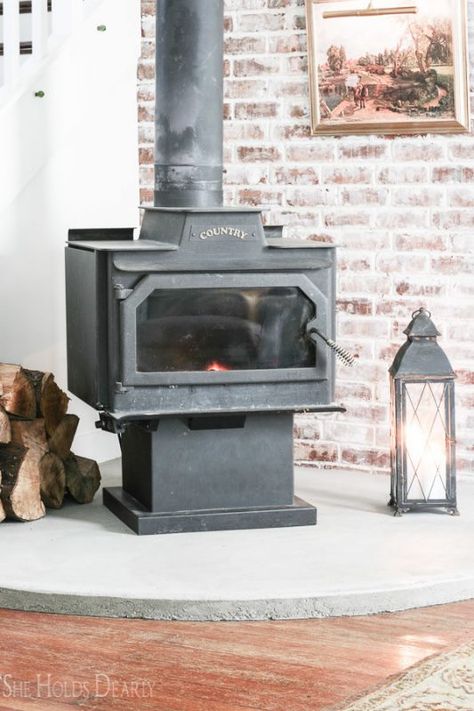 14 DIY Concrete Hearth Under Woodburning Stove In Farmhouse Renovation, By She Holds Dearly Featured On @Remodelaholic 1906 Farmhouse, Concrete Hearth, Tile Hearth, She Holds Dearly, Wood Stove Hearth, Cement Home, Beach House Living Room, Farmhouse Renovation, Freestanding Fireplace