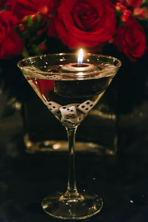 Floating candles and dice in martini glass - a fun decorative table accent for formal event. Mafia Theme Party, Harlem Nights Theme Party, Harlem Nights Party, James Bond Theme Party, Harlem Nights Theme, Mafia Party, Casino Birthday Party, 007 Casino Royale, Vegas Theme Party