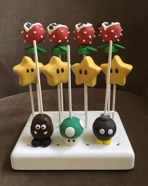 Super Mario Bros. Cake pops Mario Cake Pops Ideas, Diy Mario Cake Pops, Mario Birthday Party Cake Pops, Bowser Cake Pops, Super Mario Cake Pops Birthday, Mario Kart Cake Pops, Mario Brothers Cake Pops, Mario Birthday Cake Pops, Mario Theme Cake Pops