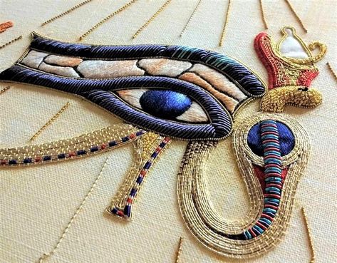 This goldwork and silk shading piece is of the Eye of Horus.  The Eye of Horus - also known as wadjet, wedjat or udjat - is an ancient Egyptian symbol of protection, royal power, and good health.  This is the work of Sarah Homfray - Embroiderer, Artist, Author - see more of her work on Instagram at https://www.instagram.com/sarah_homfray_embroidery/?fbclid=IwAR1yuyBSfwGsnOqvnXiBH2eKrOJc5r6Bv8ysNwo4pKLeJwAymA4iJRSlvI8 Egyptian Embroidery, Ancient Egypt Fashion, Bullion Embroidery, Goldwork Embroidery, Textile Embroidery, The Eye Of Horus, Egyptian Design, Gold Work Embroidery, Egypt Fashion