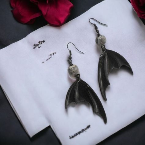 https://www.etsy.com/listing/1530794472/bat-earrings-vampire-hanging-bat-wings 🦇✨ Dive into the shadows with our Occult Witchcraft Bat Wings Earrings! These gothic black charm jewelry pieces are a must-have for women seeking unique and dark aesthetic accessories. 💀 Make a statement with these spooky earrings that embody the essence of gothic allure and mysterious beauty. #GothicStyle #SpookyFashion #DarkAesthetic #UniqueGifts #BatWings #OccultJewelry Ready to embrace the darkness within? ✨ ... Embrace The Darkness, Spooky Earrings, Mysterious Beauty, Hanging Bat, Wings Earrings, Pagan Symbols, Aesthetic Accessories, Bat Earrings, Alternative Jewelry