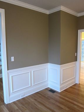 Interior shadow box wall moldings and chair rail trim in a custom dream home. Pottery Baseboard Styles, Wainscoting Styles, Interior Minimalista, Wall Molding, Wood Flooring, Living Room Paint, Wainscoting, Room Paint, White Trim