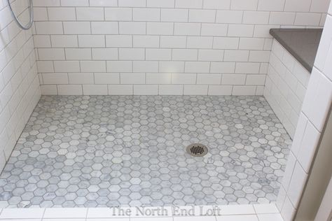 The shower floor is hexagon-shaped marble tiles with darker gray grout. We had the marble sealed and upgraded all the grout to one that resists mold and fading. Hexagon Shower Floor, Mold In Bathroom, Shower Floor Tile, Tiled Shower, Bathroom Remodel Shower, Upstairs Bathrooms, Bathroom Redo, Bathroom Floor Tiles, Bath Room