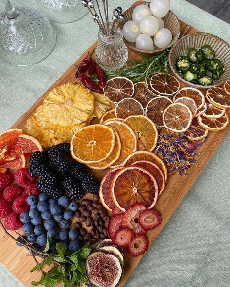 Grab your guest’s attention with a delicious garnish board 🤩 // This gorgeous example features a range of our dehydrated products: - Citrus Wheels (Orange, Blood Orange, Lemon & Lime) - Grapefruit Halves - Fig & Strawberry Slices - Chillies & Pineapple Flowers - Cocktail Confetti // Cheers 🍹 #garnishboard #barcuterieboard Garnish Board For Drinks, Dehydrated Garnish Cocktails, Garnish Board, Dehydrate Pineapple, Drink Garnish, Perfect Bar Cart, French Baby Shower, Citrus Garnish, Fruit Garnish