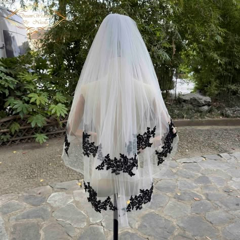 Description Tulle Colour:White/Light Ivory/Ivory/Black/champagne Top layer:31.49in/2.62ft / 80cm Bottom layer:39.37in / 3.28ft/ 100cm Widest layer:59in /4.92ft/ 150cm Comes with comb attached Materials:Tulle,Black Lace,Metal hair Comb (Please refer to the pictures above that were taken per the real product) 100% handmade Thank you for looking Cathedral Length Veil: https://www.etsy.com/shop/DreamWeddingByNicola?section_id=26697260 Elbow Length Veil: https://www.etsy.com/shop/DreamWeddingByNicola White Dress With Black Veil, Spiderweb Wedding Veil, Black Veil White Dress, White Wedding Dress With Black Veil, Short Black Veil, White Veil With Black Lace, Black And White Veil Wedding, White Wedding Dress Black Veil, Black And White Wedding Veil