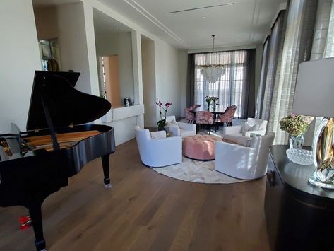 Piano room sophistication: Sleek grand piano, plush seating. Natural light highlights hardwood floors in this entertaining space. Piano Lounge, Light Highlights, Piano Room, Entertaining Space, Construction Home, Studio Interior, Grand Piano, Entertainment Space, Landscape Architect