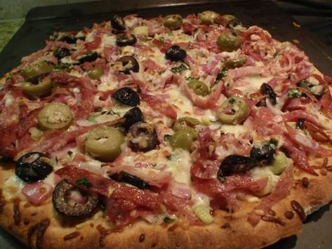 A 5-star recipe for Muffaletta Pizza made with black olives, green olives, celery, red onion, garlic, fresh basil, fresh parsley Muffaletta Pizza, Pizza Calzone Recipe, Grilled Cheese Panini, Detroit Style Pizza Recipe, Calzone Recipes, Muffuletta Sandwich, Olive Pizza, Focaccia Pizza, Calzone Recipe