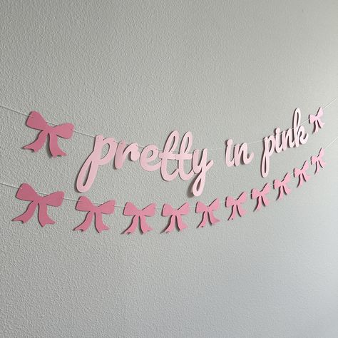 Prepare to be delighted, this customizable pretty in pink banner is the perfect addition to your party decor!  ---OPTIONS--- > Pretty In Pink: Will contain the phrase "pretty in pink" along with 2 bows.  Measures approximately 4' long and is adjustable by sliding the items on the string. > Custom Sign (with number of letters): Will contain your custom message along with 2 bows. Please be sure to write a personalization with the message you would like. --- DETAILS --- > Made with card stock paper Aesthetic Party Theme Ideas, Pink Room Decor Ideas Diy, Pink Party Decor Ideas, Pastel Pink Birthday Party, Pretty In Pink Theme, Pink Birthday Set Up, Baby Pink Birthday, Bow Party Ideas, Pink Bday Party