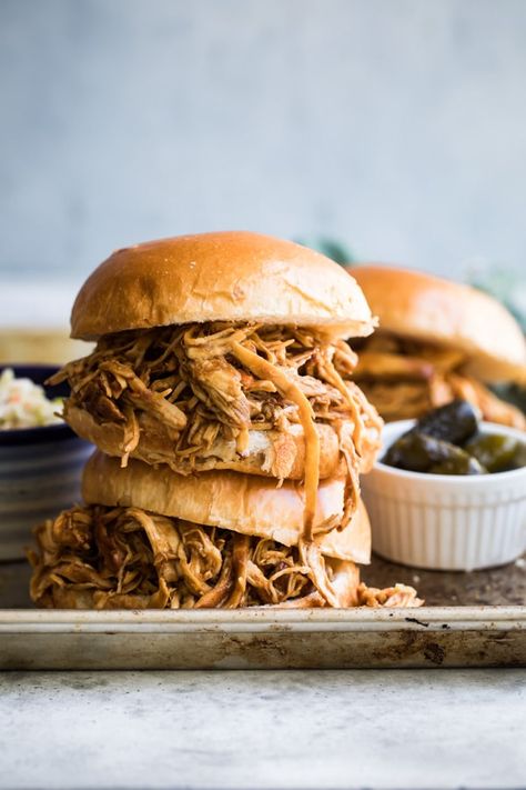 Nothing beats Slow Cooker Pulled Chicken piled high on a soft toasted bun. Make extra, because hungry people everywhere love the sweet and smoky allure of easy pulled barbecue chicken. #pulledchicken #slowcookerpulledchicken Slow Cooker Pulled Chicken, Crockpot Pulled Chicken, Pulled Chicken Recipes, Chicken Slow Cooker, Braised Chicken Breast, Pulled Chicken Sandwiches, Slow Cooker Recipe, Chicken Sandwiches, Crockpot Recipes Beef