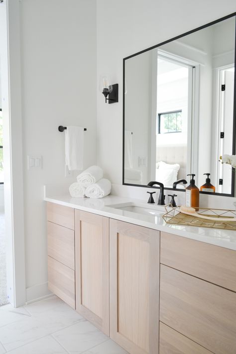 Modern farmhouse master bathroom White oak vanity with quartz counters and black sconces. Build by Destination Homes Iowa. Staging by Green Door Home Staging Black White Oak Bathroom, Modern White Oak Vanity, Bathroom Vanity White Cabinets, White Oak Vanities, White Oak Cabinets Bathroom, Bathroom White Oak Vanity, Bathroom With White Oak Vanity, White Oak Bathroom Cabinets, White Oak Vanity Bathroom