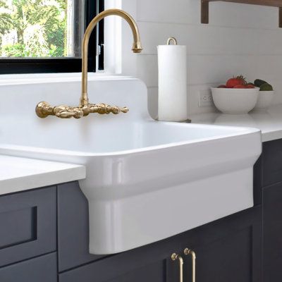 This exceptional sink features a generous size and a high backsplash, offering ample space for all your kitchen needs while adding a touch of sophistication to your kitchen décor. Crafted with precision and durability in mind, this sink is built to withstand the rigors of daily use while maintaining its timeless beauty. Elevate your kitchen with this solid fireclay kitchen sink, and experience the epitome of size, style, and practicality. 30" single bowl fireclay kitchen/utility sink with a high High Back Sink Kitchen, Apron Front Bathroom Sink, Kitchen Sink With Backsplash, Unique Kitchen Sink Ideas, Florida Mudroom, High Back Farmhouse Sink, Laundry Room Sinks, Farmhouse Sink Ideas, Mudroom Renovation