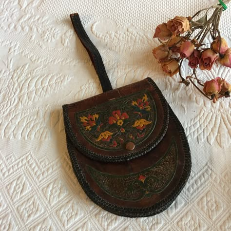 "Vintage Leather Wrist Purse Pouch Style. Decorative Leather Strap Woven Edge and Hand Painted Embossed Floral and Swirl Designs on Front. Cotton Lined. This purse is in good shape for its age. The strap is worn where it folds in half but will hold. The leather work is wonderful. There are no holes in the lining. Size: 5 7/8\"X 6 3/4\" Tall, Strap 7 3/4\" Folded or 15 1/2\" if straight For other vintage items see: www.VeryVictorianStudio.etsy.com For sewing related items see my other shop: www.S Painted Purses, Ren Faire Purse, Medieval Purse, Vintage Embroidered Leather Bags, Brown Hand Painted Satchel Shoulder Bag, Dog Portrait Drawing, Vintage Brown Hand Tooled Bag, Purse Aesthetic, Embroidered Leather