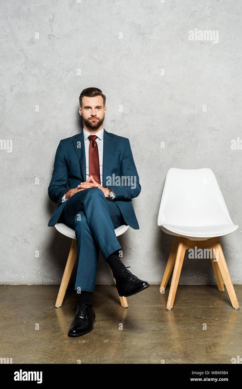 Download this stock image: handsome bearded man sitting with crossed legs on chair in office - WBM9B4 from Alamy's library of millions of high resolution stock photos, illustrations and vectors. Man Sitting Cross Legged On Chair, Men Sitting Cross Legged, Sitting Cross Legged Reference Chair, Man In Suit Sitting In Chair, Guy Sitting Cross Legged Reference, Lap Sitting Drawing Reference, Sitting Legs Crossed Reference, Man Sitting Reference, Guy Sitting In Chair