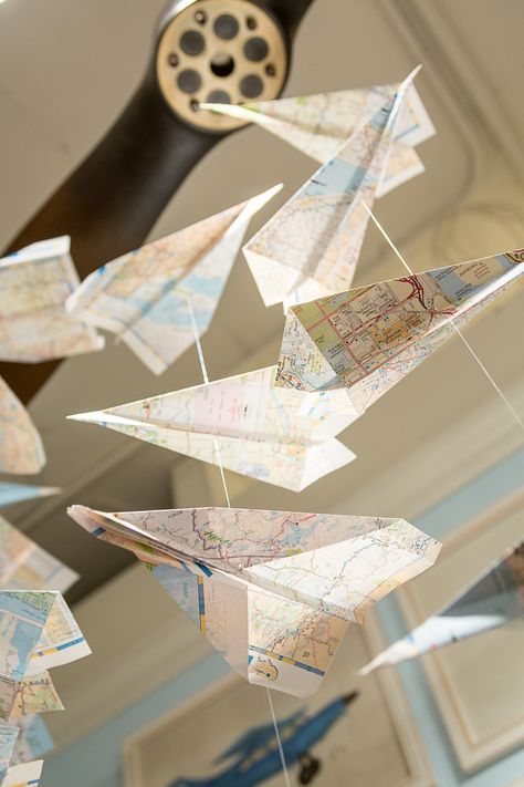 Paper map airplane mobile.  Young America showroom, Spring Market 2013 Airplane Garland, Airplane Boys Room, Dzimšanas Diena, Airplane Mobile, Airplane Paper, Airplane Room, Adventure Room, Airplane Activities, Aviation Theme