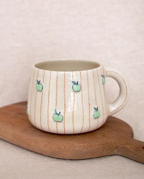 Autumnal apple cup 🍏 handmade and hand painted 🖌️ Hand Thrown Mugs, Autumn Pottery, Thrown Mugs, Mug Ideas, Apple Cup, Clay Inspo, Pottery Inspo, Cup Sleeves, Cup Handmade