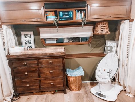 Green boho nursery with wooden dresser and plants. Small space nursery. Neutral nursery. Boy nursery. Travel Trailer Nursery, Fifth Wheel Nursery, Nursery In Rv, Camper Nursery Ideas, Rv Baby Nursery, Rv Nursery, Trailer Living With Newborn, Rv Living With Baby, Small Master With Bassinet